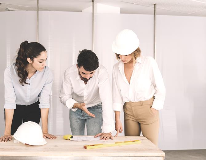 Homemakers design and engineering team reviewing drawings